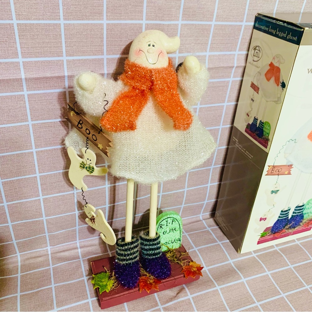 Charming long-legged Halloween ghost figurine